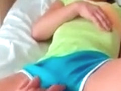 Smiling latina gets boobs and pussy teased in bed