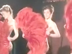 Cabaret performers get naked and dance on the stage