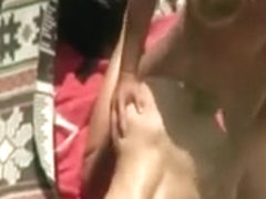 Spying horny couple on the beach