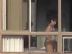 Naked mature spied through her apartment window
