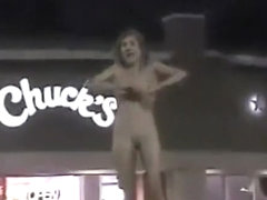 Skinny exhibitionist undresses in a fast food parking lot