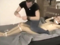 Guy tied to bed and tickled