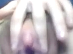 Mature babe rubs her pussy.