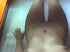 Hot busty babe caught on a hidden camera in solarium