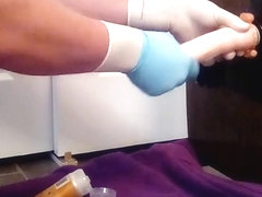 Guy riding dildo in surgical gloves