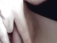 Fingering her shaved pussy closeup