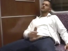 Two hot guys jerking off on a train