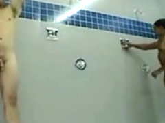 Two muscular marines take a long shower.