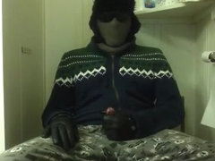 Jerk-off in hood, jacket, and gloves 10